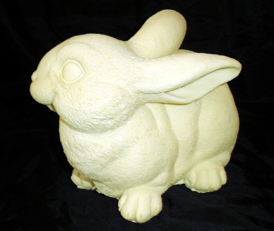 Фигурки кроликов из белого шоколада. Символы 2023 года из шоколада